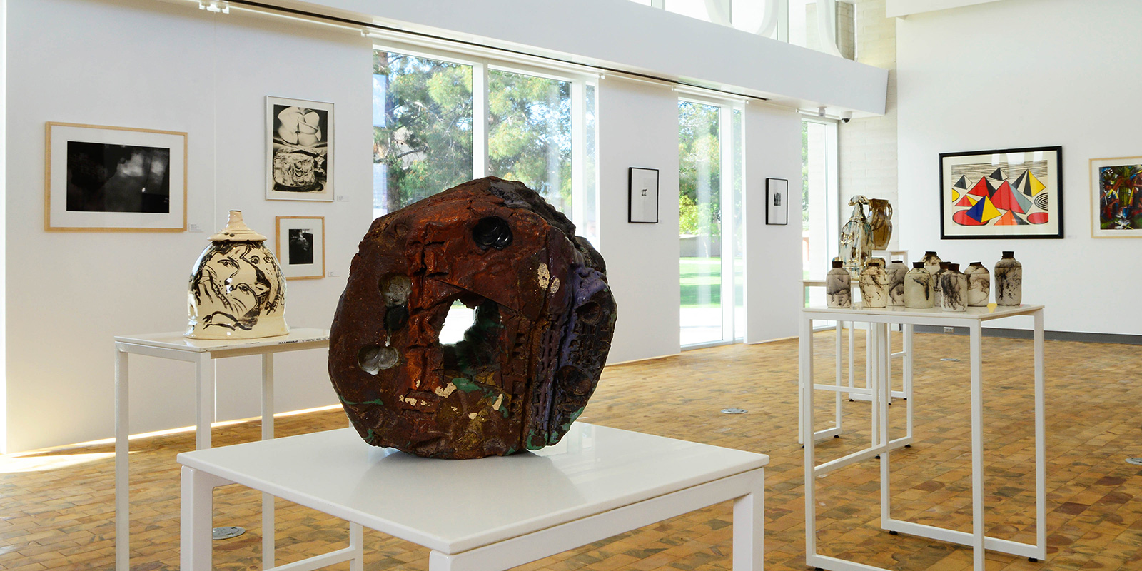 Sculptures of various sizes on display in the gallery.