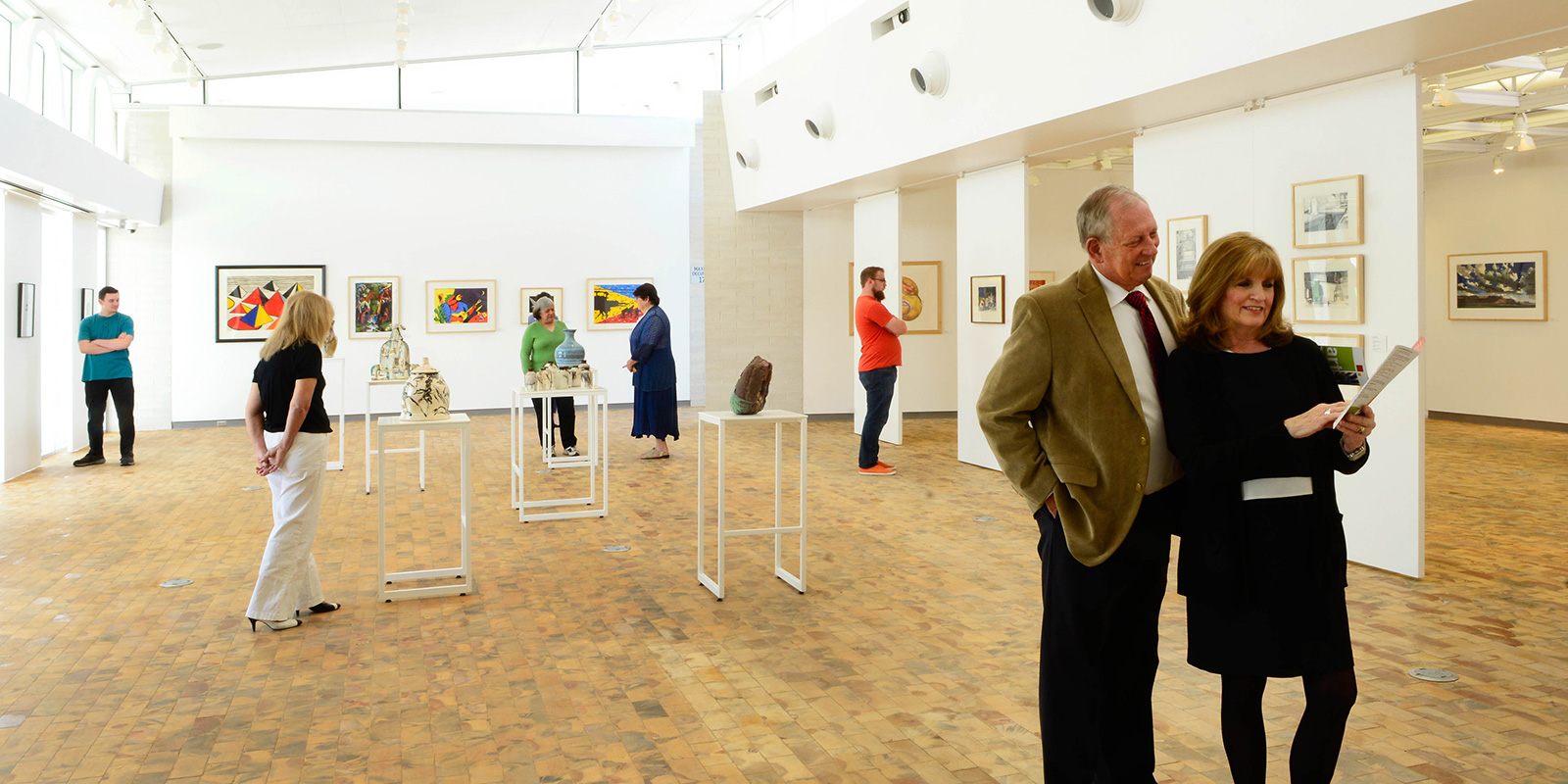 Visitors explore the art gallery.