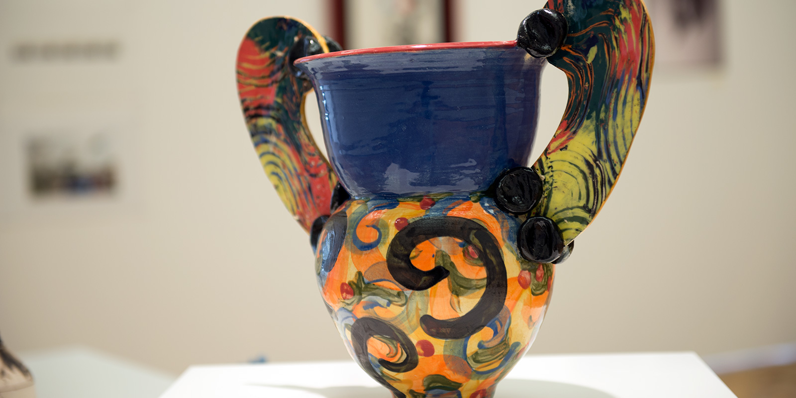 Decorative urn with handles on both sides.