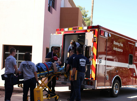 Patient being loaded into ambulance