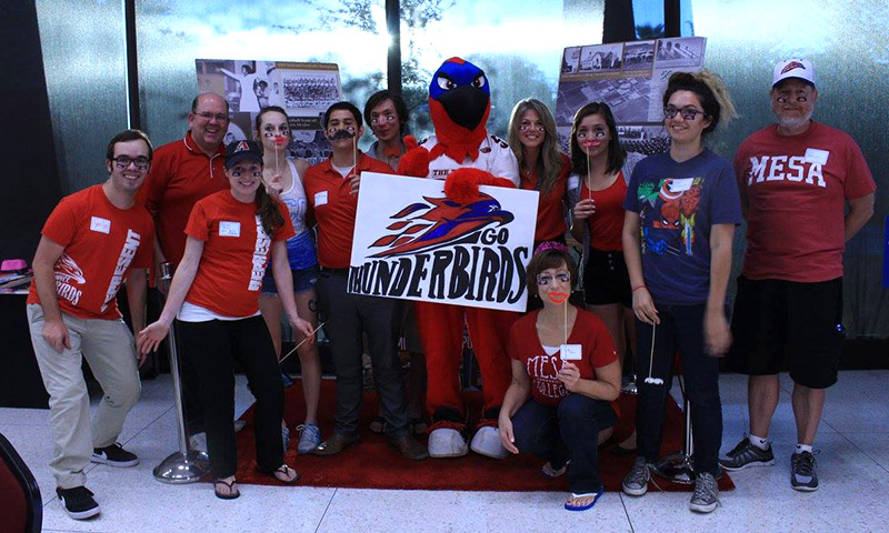 Students and staff pose with Thor the Thunderbird.