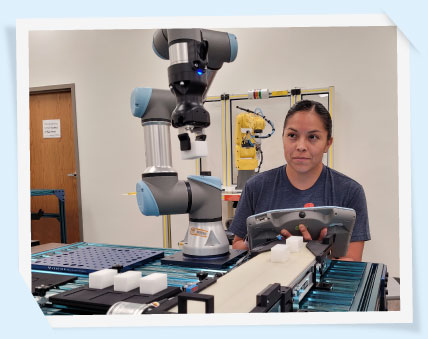 Student working with a robot