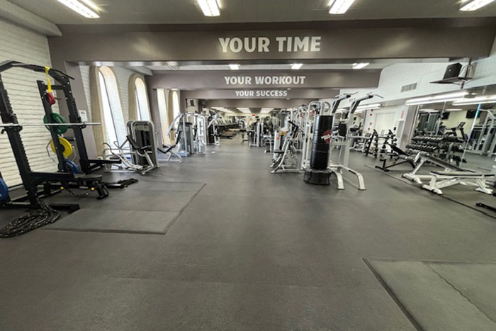 The words Your Time, Your Workout, Your Success on ceiling beams