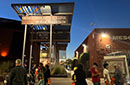 People outside on the Red Mountain campus, some in Halloween costumes