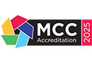 A logo with the words MCC Accreditation 2025 and a pinwheel design