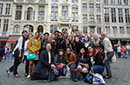 A group of students posing in front of a building in Europe