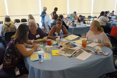 Faculty and others participate in a workshop with Dr. Kellner