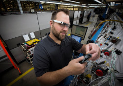 Boeing Mesa Employee works on electrical cable harness wiring in the Electrical Center of Excellence.