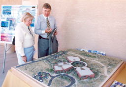 Linda Rosenthal (left) and Larry Christiansen view the architectural rendering of Red Mountain.