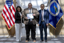 Lisa Ramirez, Director U.S. Department of Agriculture Office of Partnerships and Public Engagement (OPPE) and Roberto Velasco II, Chief Financial Officer, U.S. Forest Service, USDA HACU Leadership Group presents the Education Fellow certificate to Michael Gaspar, Mesa Community College during the 2024 USDA E. Kika De La Garza Fellows ceremony on Thursday, July 11, 2024, at the USDA in Washington D.C